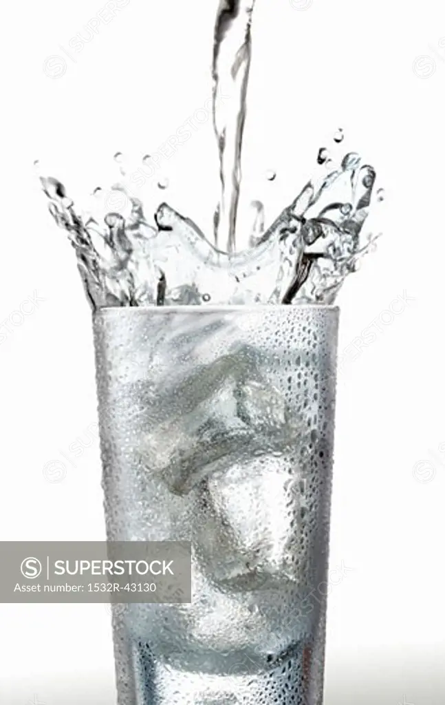 Pouring water into a glass