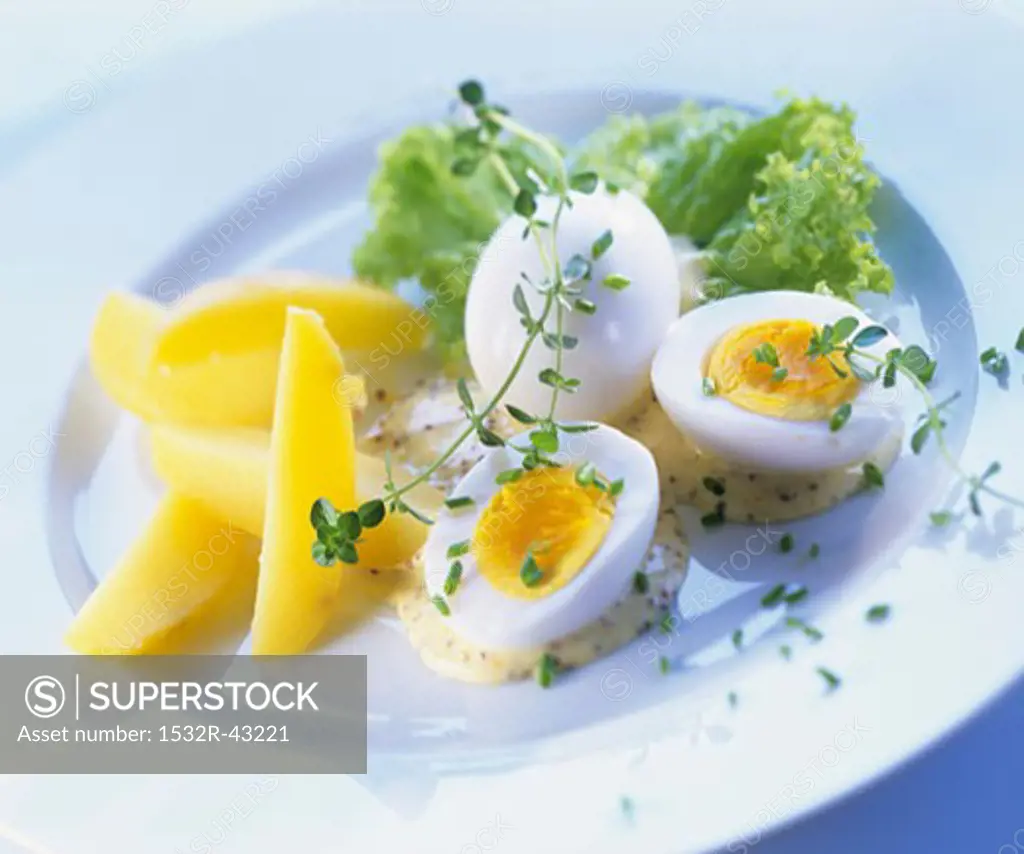 Boiled eggs with mustard sauce and boiled potatoes