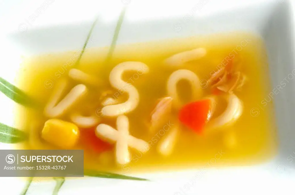 Chicken and carrot soup with alphabet pasta