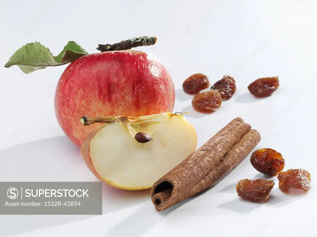 Apple with cinnamon stick and raisins