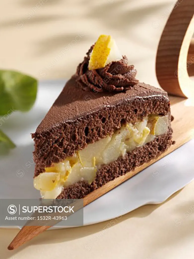 A piece of chocolate cake with pear filling