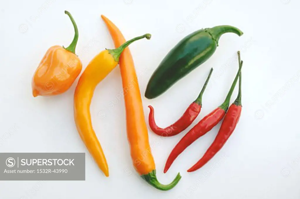 Orange, green and red chillies