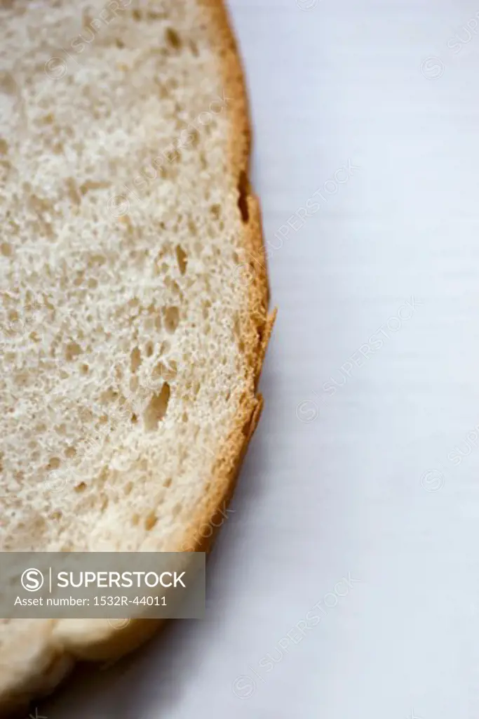 Part of a slice of white bread
