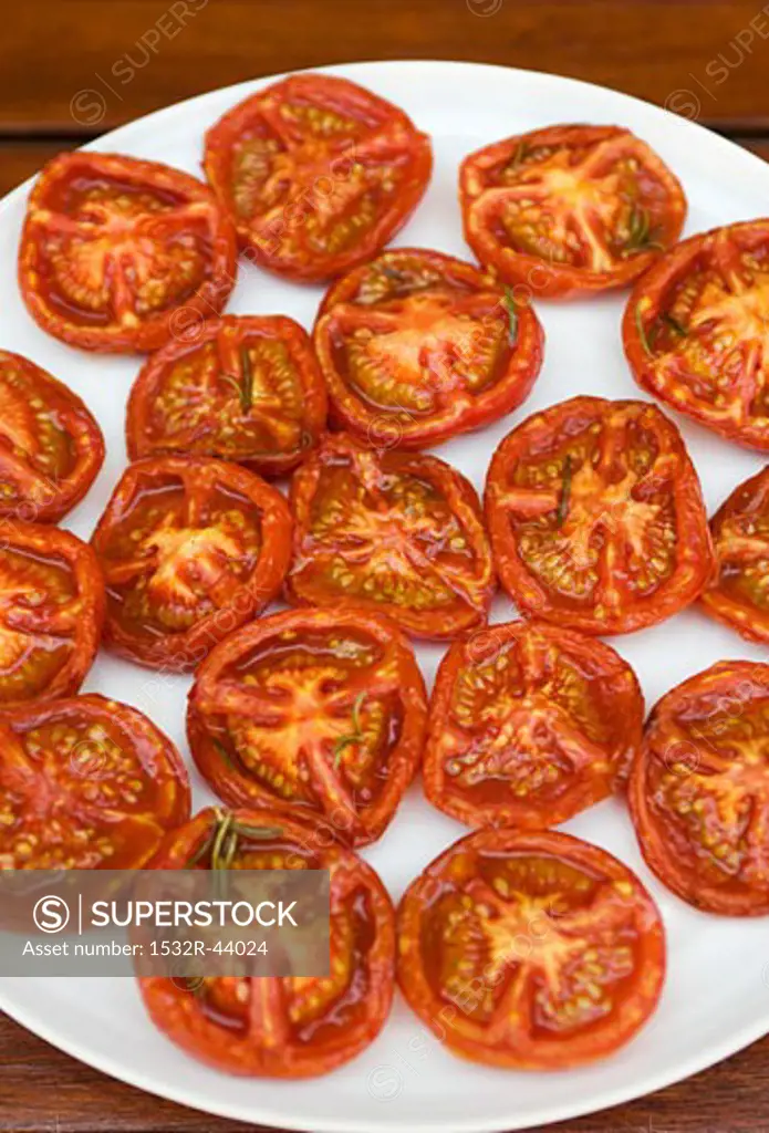 Fried tomato halves on a plate