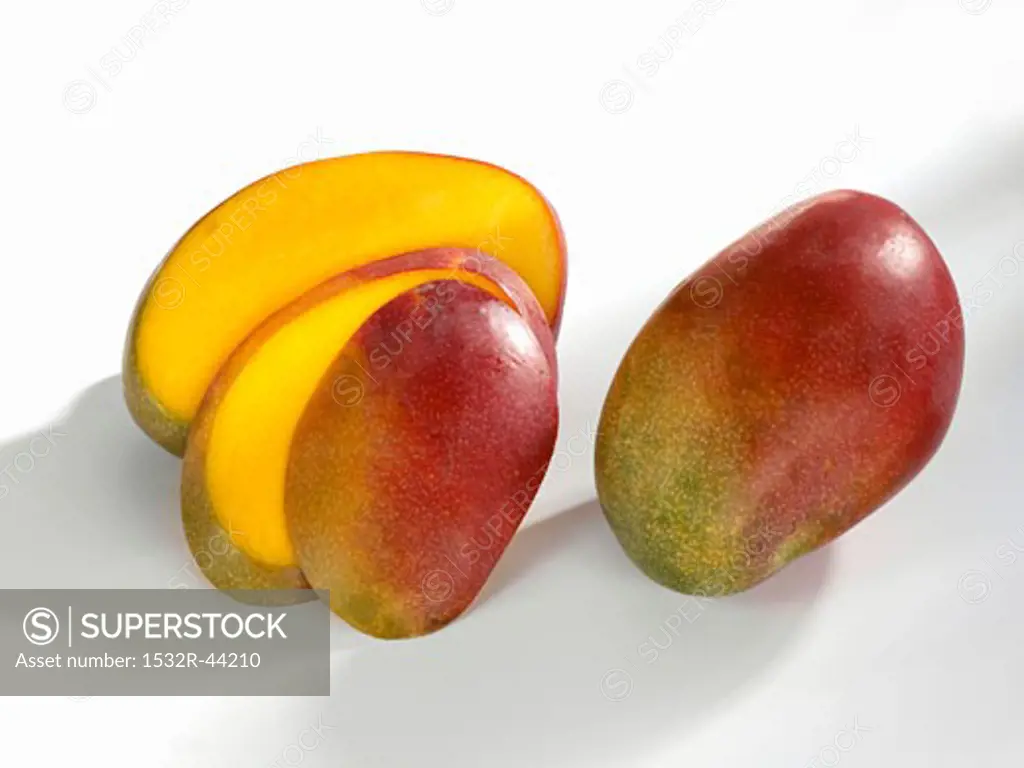 Whole and sliced mango