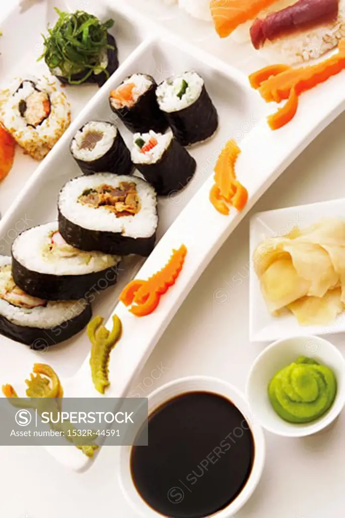 Sushi platter with soy sauce, wasabi paste & pickled ginger