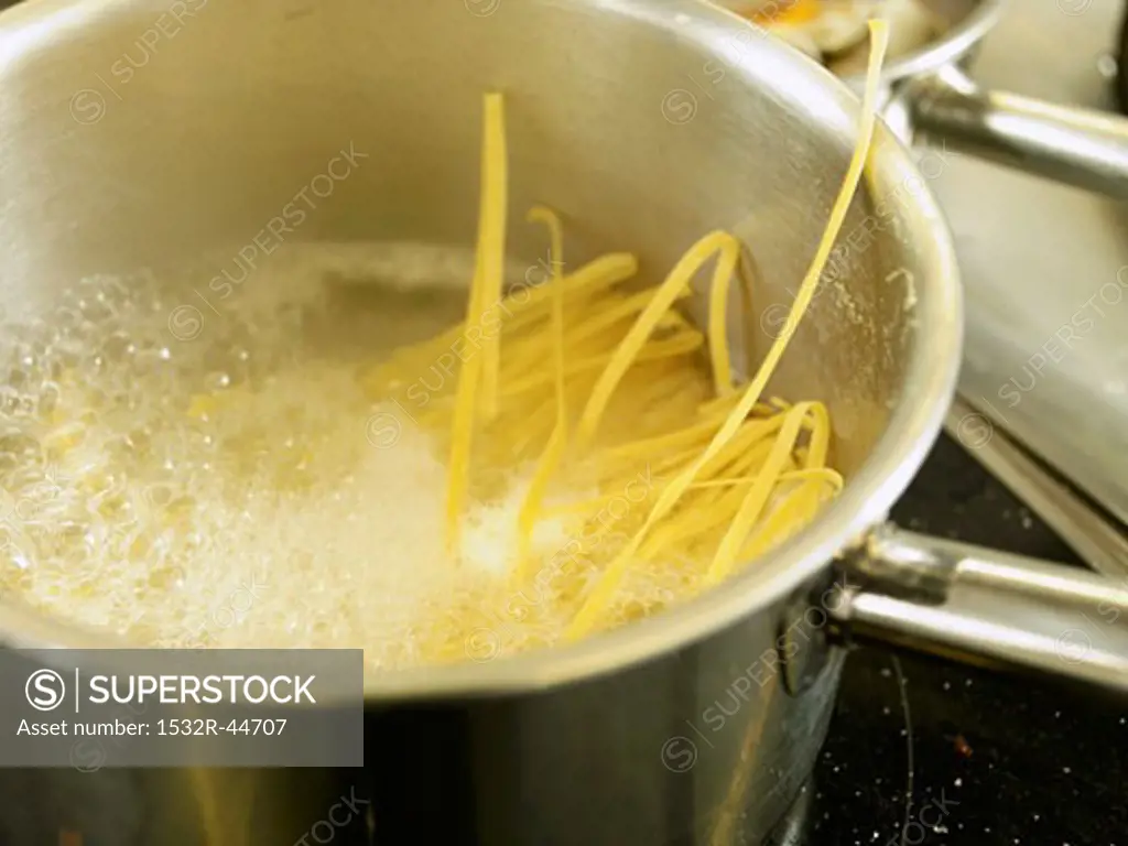 Ribbon pasta in boiling water