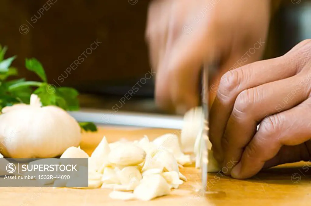 Chopping garlic cloves