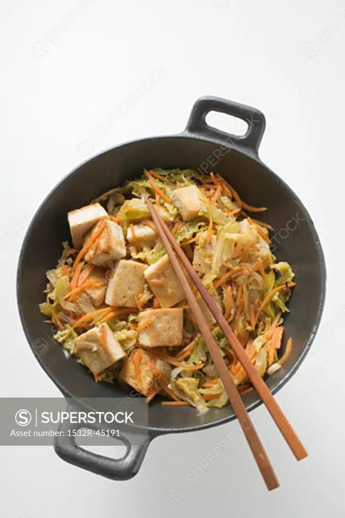 Tofu with vegetables in wok (overhead view)