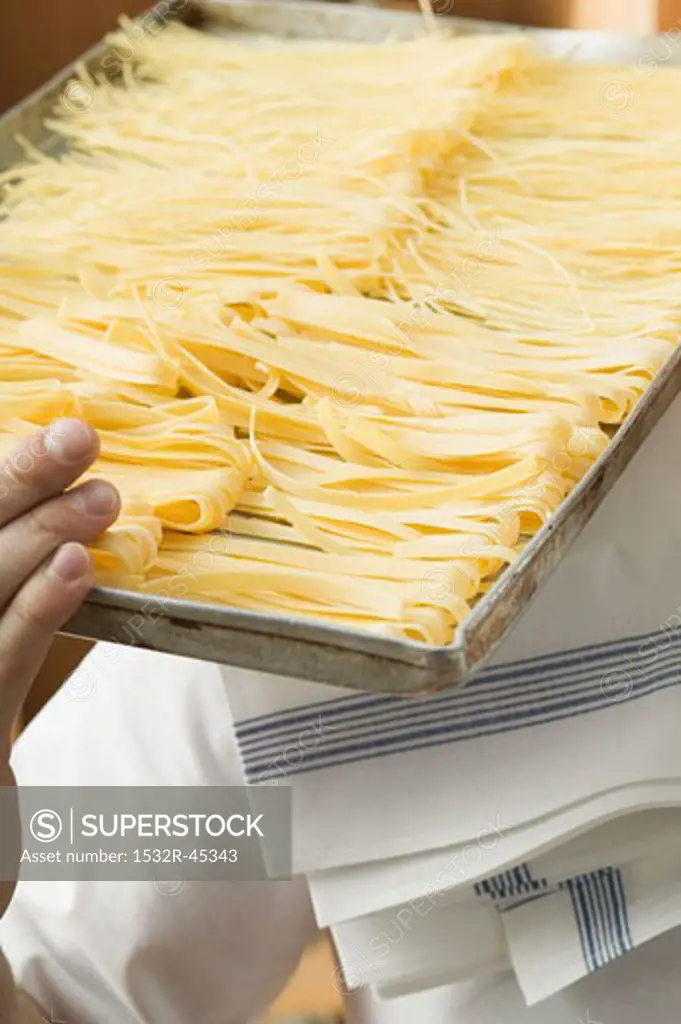 Home-made pasta on baking tray