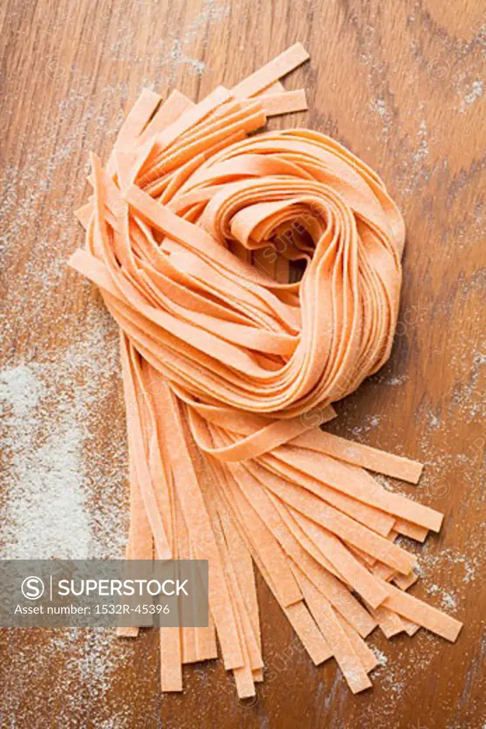 Home-made orange ribbon pasta