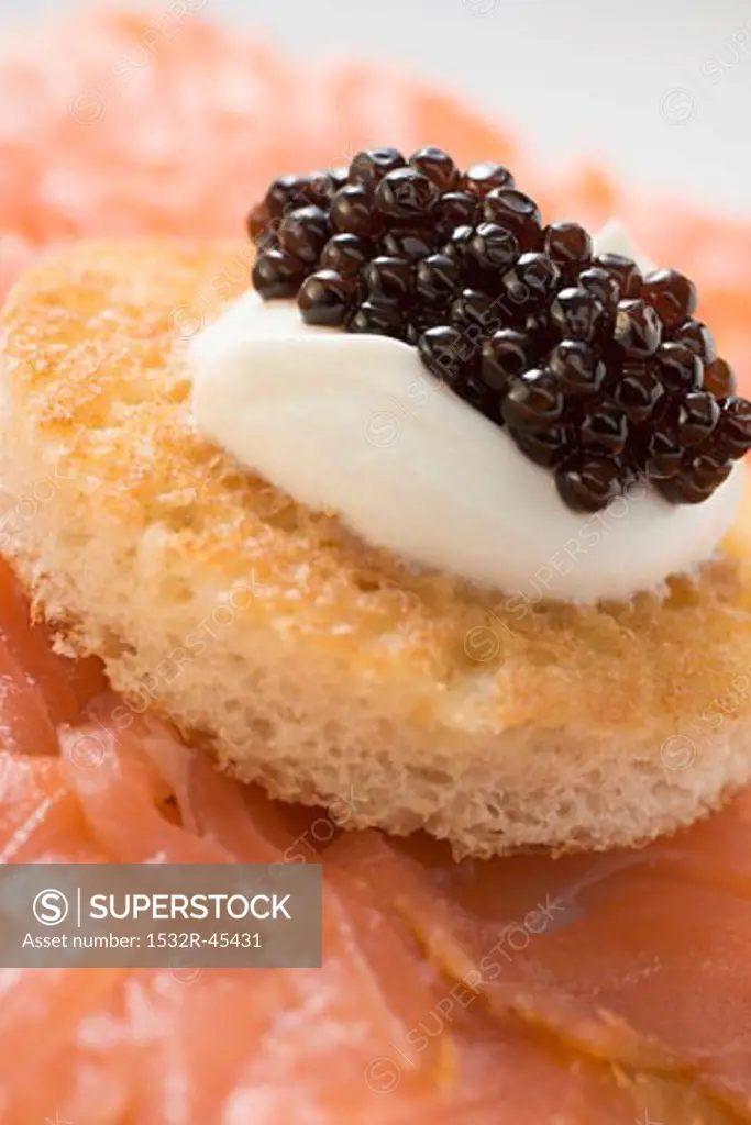 Smoked salmon with caviar and sour cream canapé