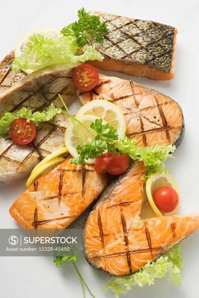 Grilled cutlets and fillets of salmon and cod