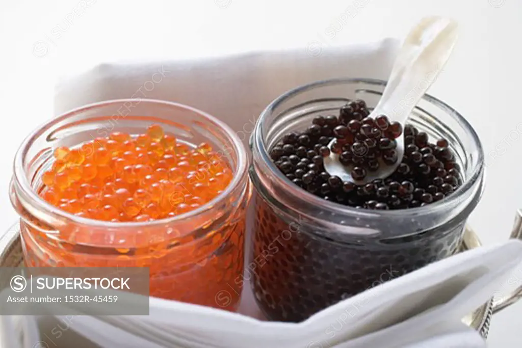 Black caviar and Keta caviar in jars