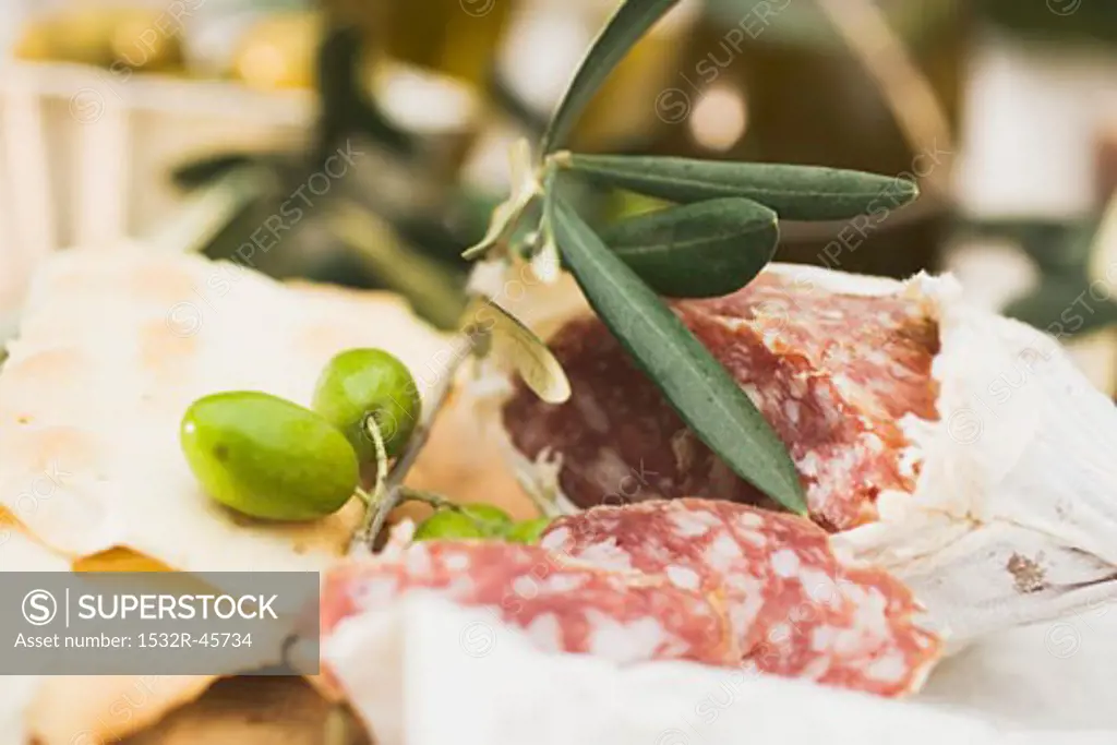 Salami, green olives and crackers