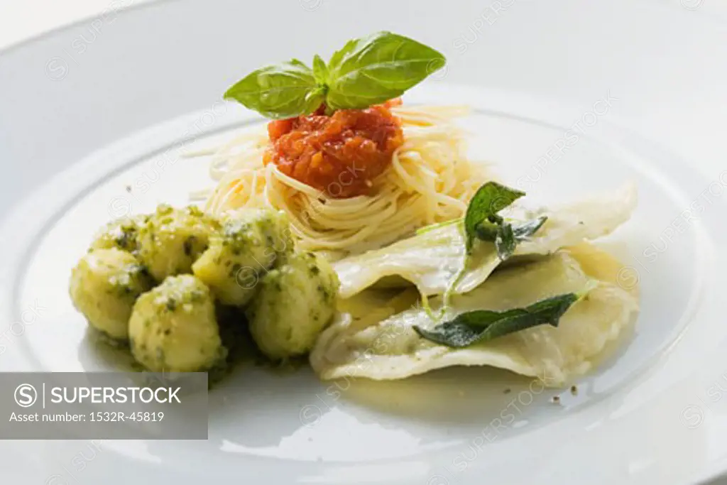 Spaghetti, gnocchi and ravioli on a plate