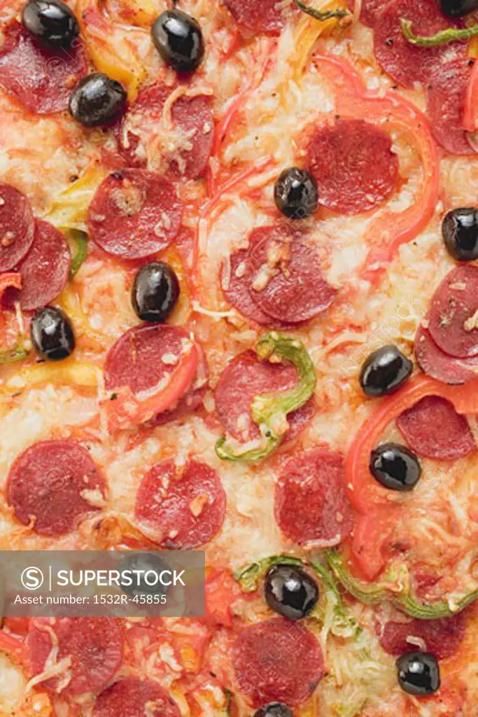 Pepperoni pizza with peppers and olives (full-frame)