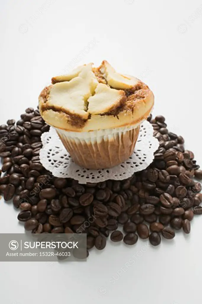 Muffin on a heap of coffee beans