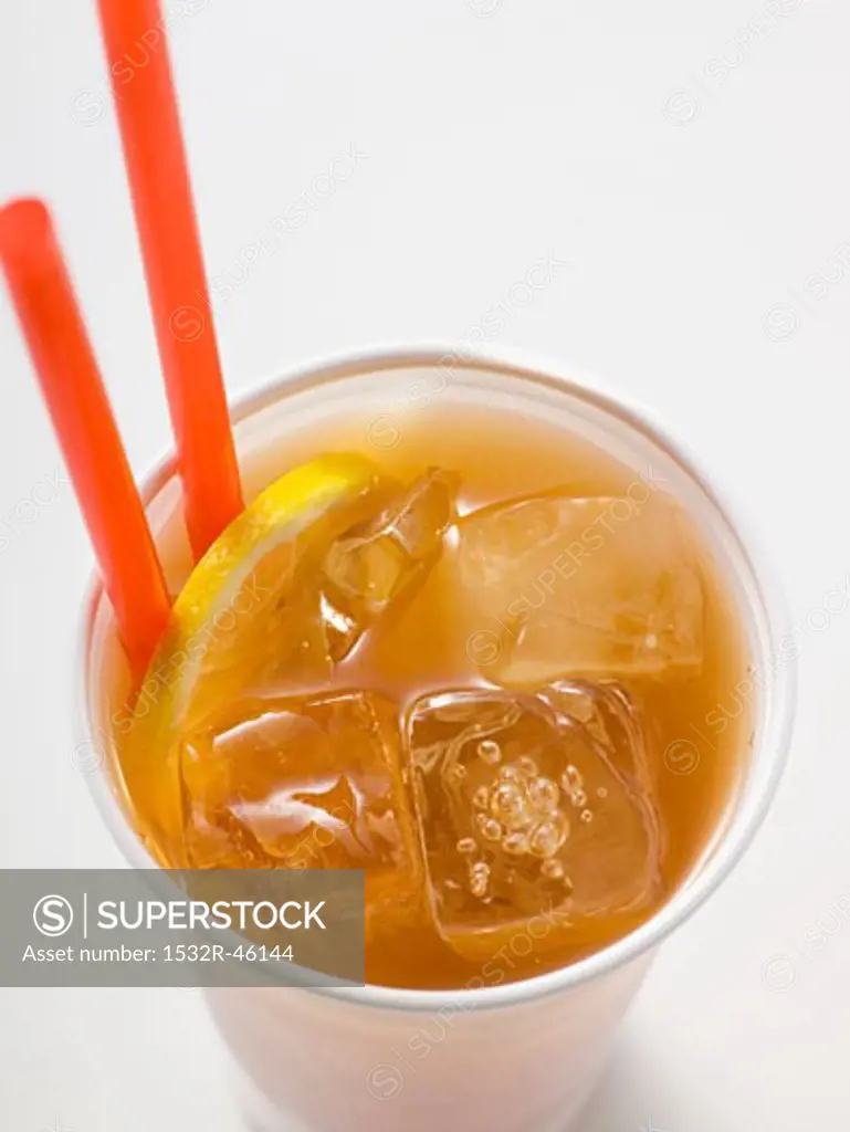 Iced tea with lemon and straws in plastic cup