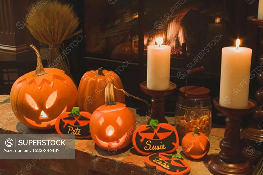 Halloween decorations (pumpkin lanterns, candles, place cards)