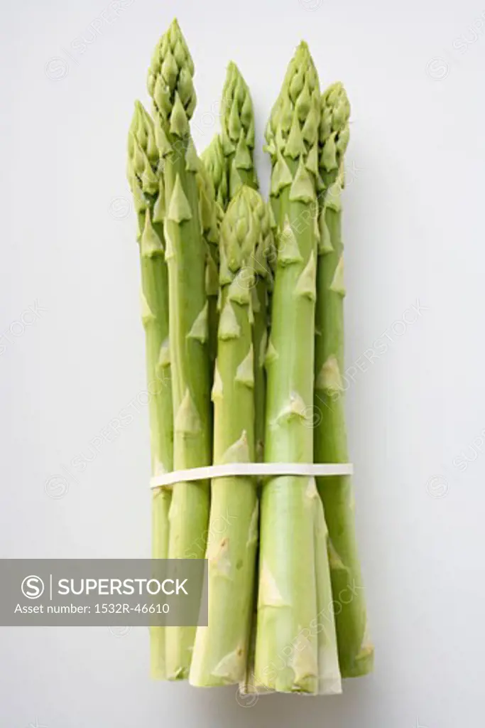 A bundle of green asparagus, on white background