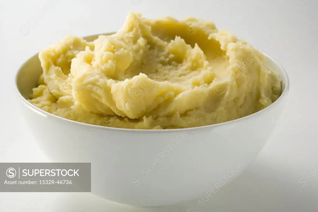 Mashed potato in white bowl
