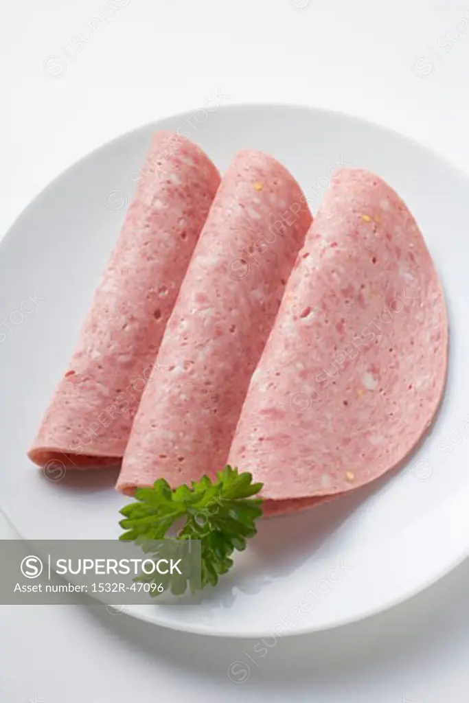 Three slices of Bierwurst (beer sausage) on plate