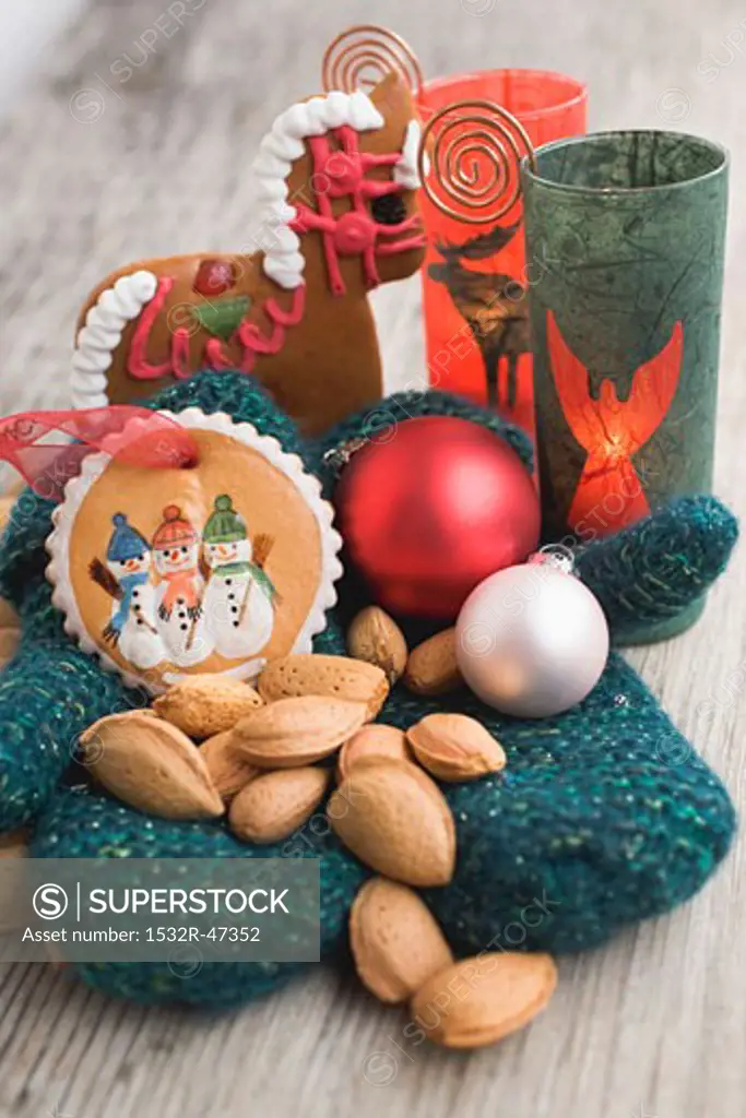 Gingerbread tree ornaments, almonds, mittens, baubles & candle