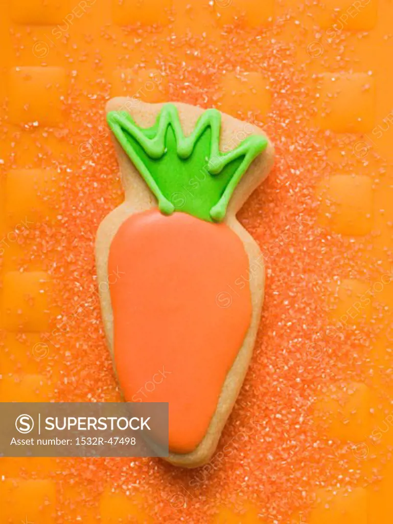 Easter biscuit (carrot) on orange background