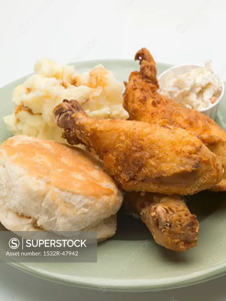 Fried chicken with mashed potato, coleslaw and scone