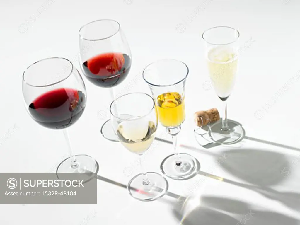 Various wines in glasses, one glass of sparkling wine
