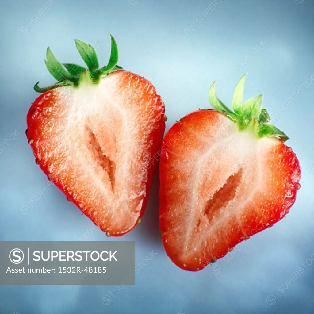 Two halves of a strawberry
