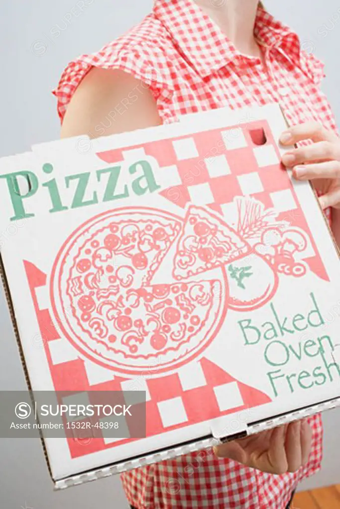 Woman holding pizza box