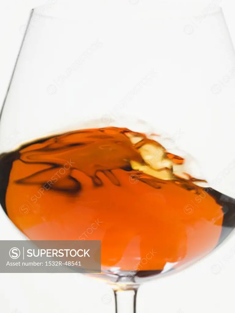 Cognac swirling in a glass