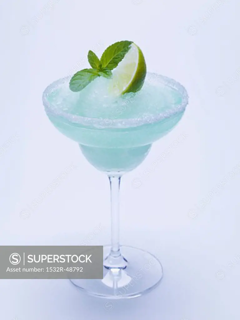 Frozen Margarita with lime wedge and mint