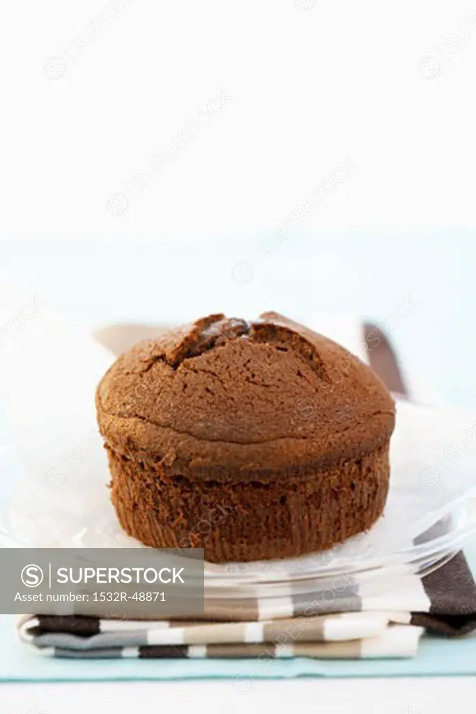 Small chocolate cake on plate