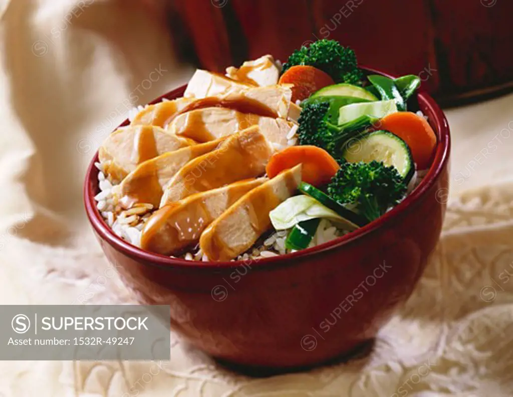 Stir-fried chicken and vegetables on rice