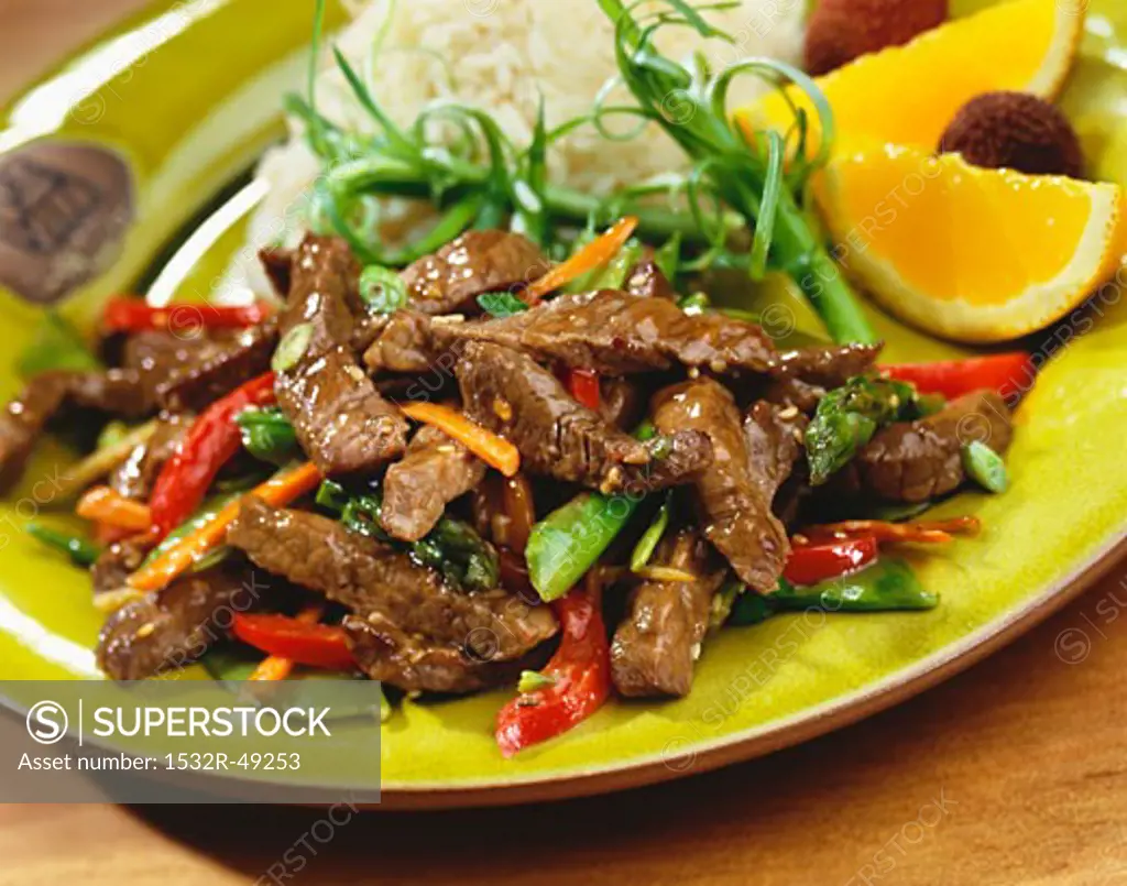 Stir Fried Beef and Vegetables on a Plate with Rice