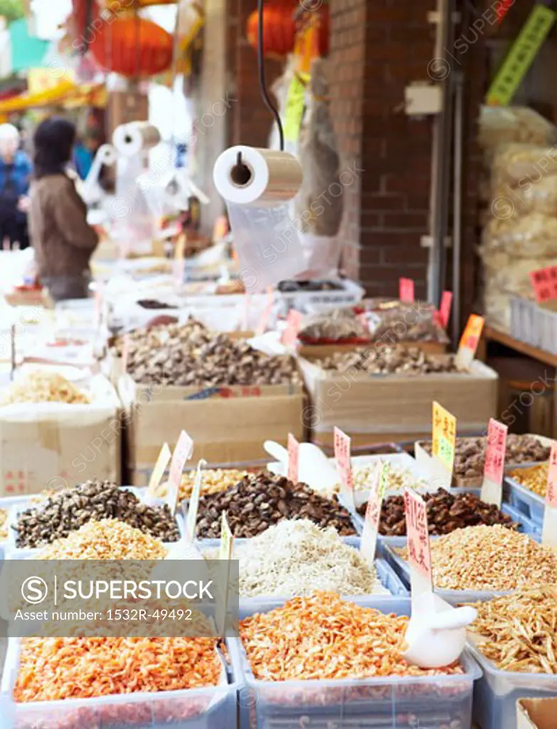 Dried shrimps, mushrooms on market stall (Chinatown, Vancouver)