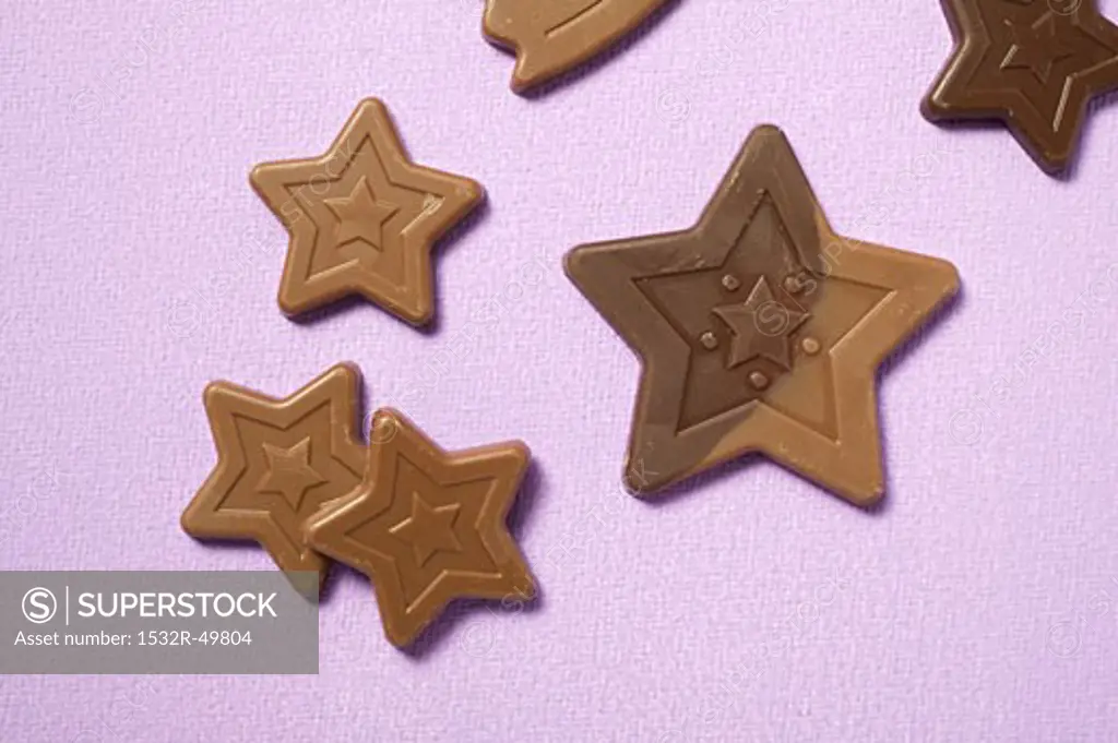 Chocolate stars on purple background