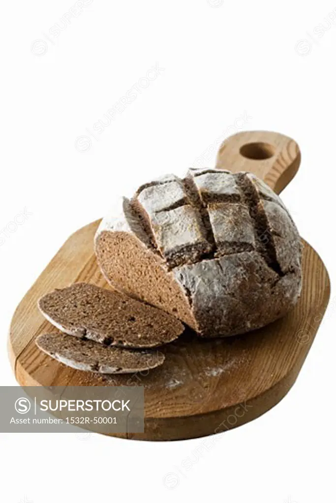 Dark rye bread, partly sliced