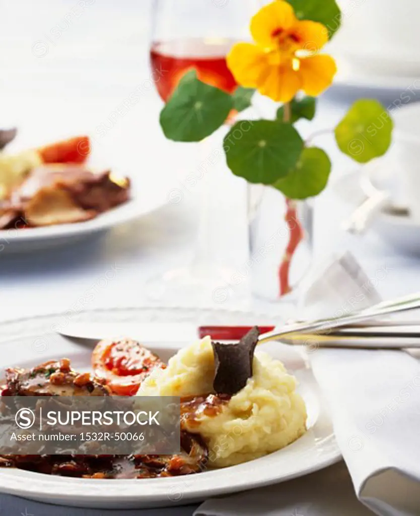 Slices of meat with ceps and potato and celeriac mash