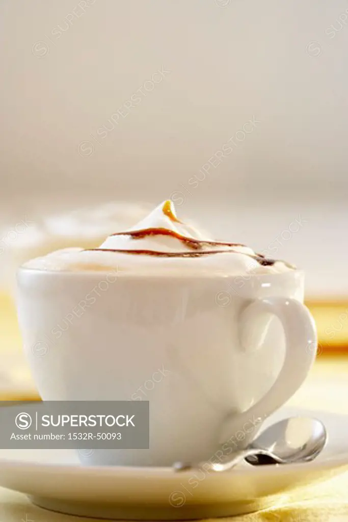 A cup of cappuccino with caramel