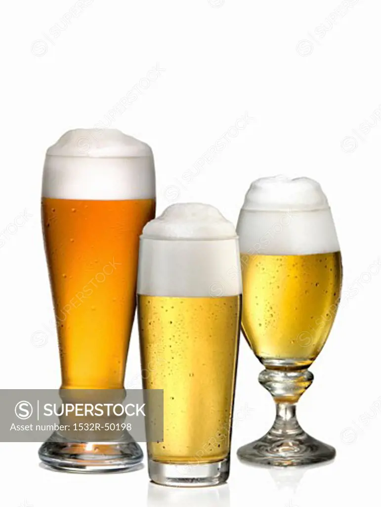 Three different glasses of beer