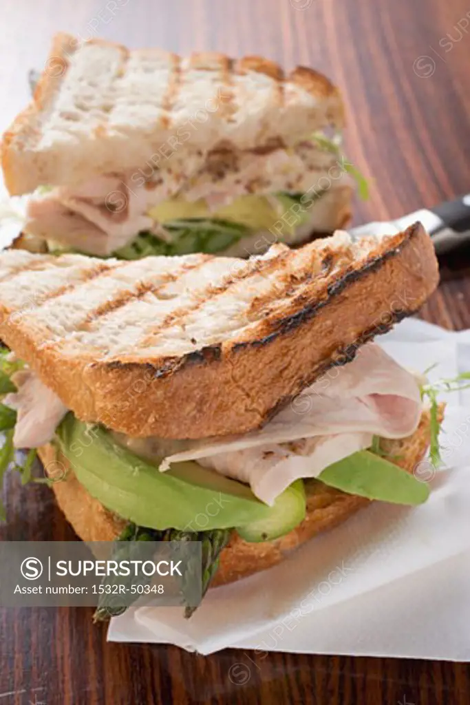 Turkey, avocado and asparagus in toast sandwich