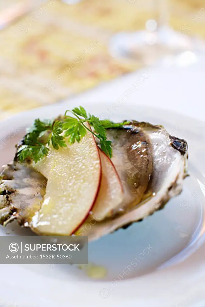 Oyster with slices of apple