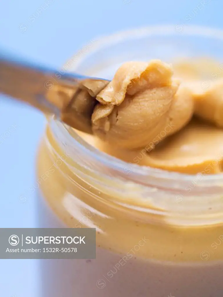 Peanut butter in jar (close-up)
