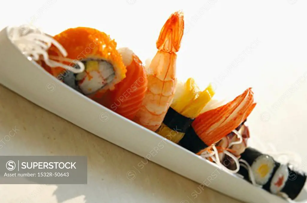 Assorted sushi in a long dish