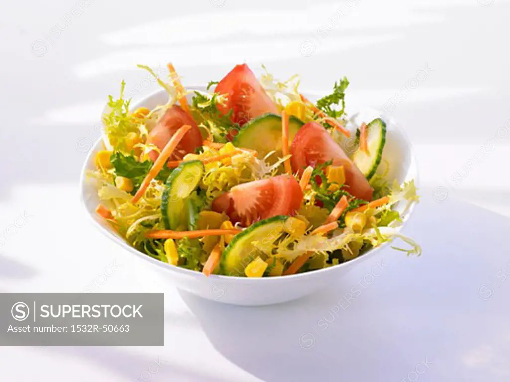 Frisée with cucumber, tomato, sweetcorn and carrot