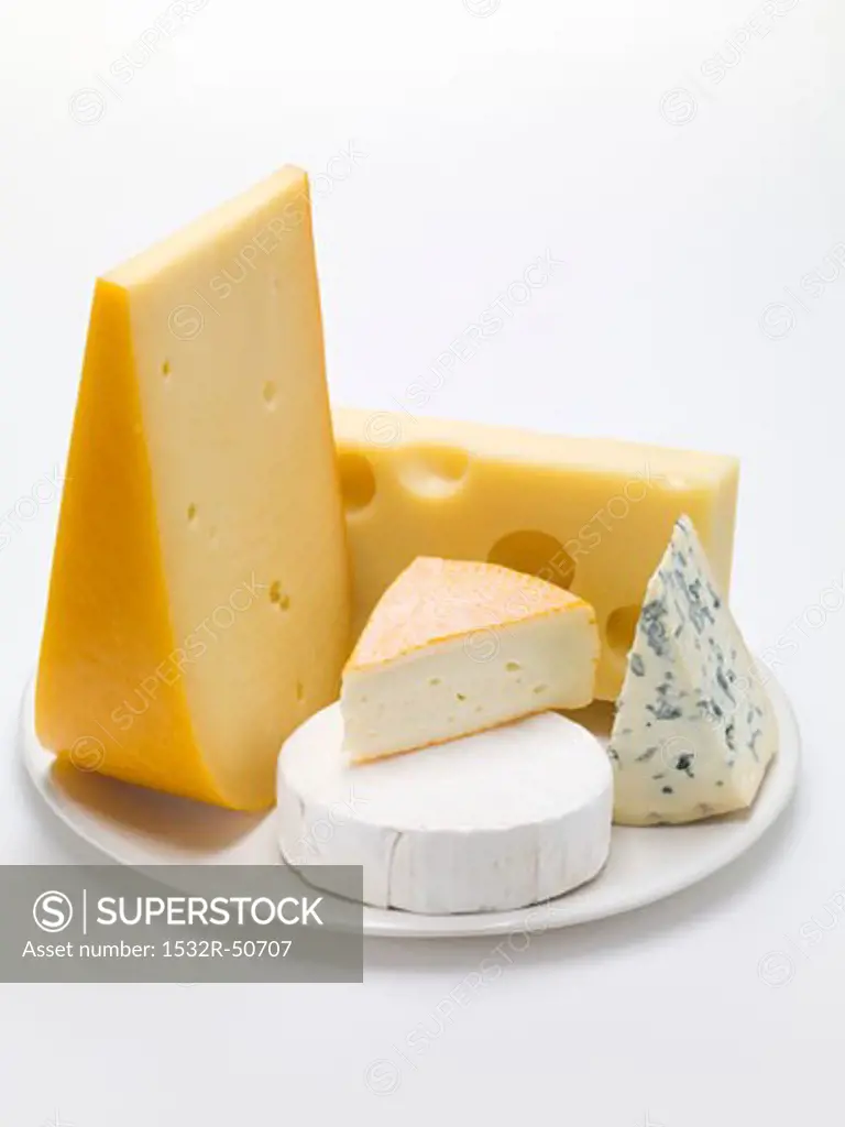 Pieces of different cheeses on plate
